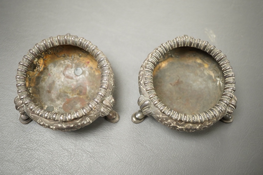 A pair of Victorian embossed silver bun salts, by Elkington & Co, Birmingham, 1852/3, top diameter 65mm, 7.7oz.